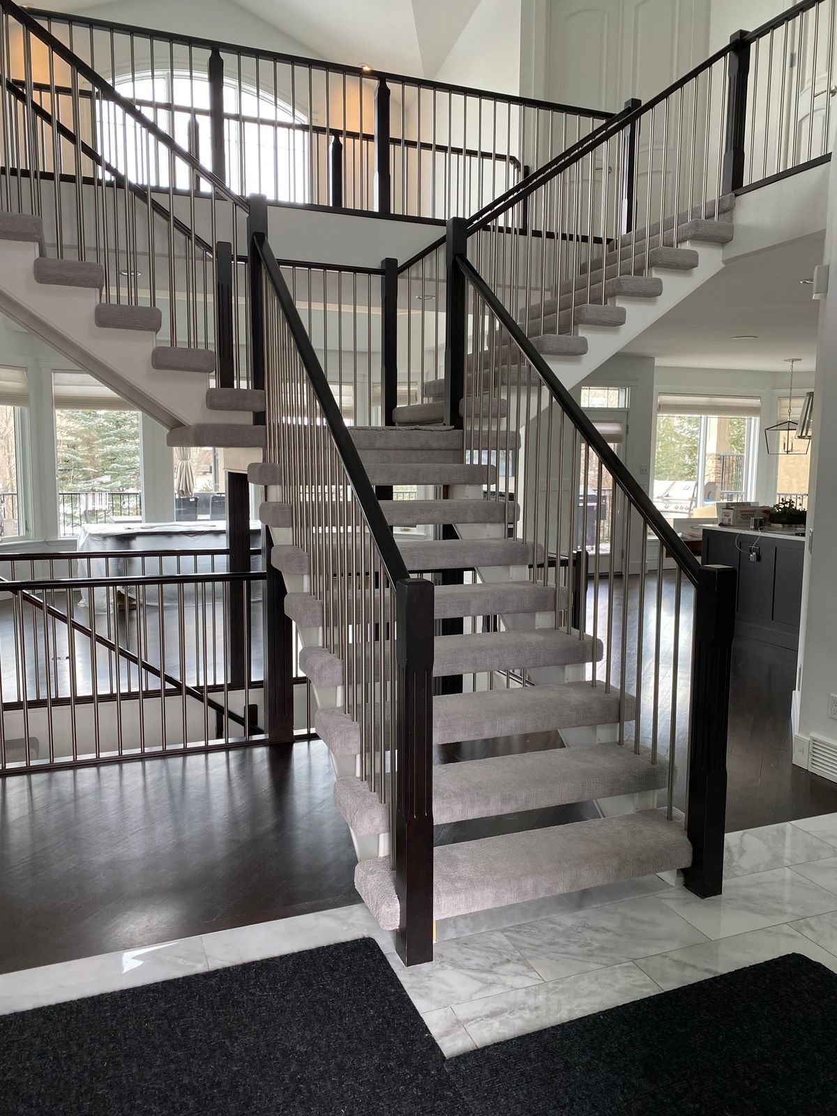 Modern open staircase with new treads and flooring