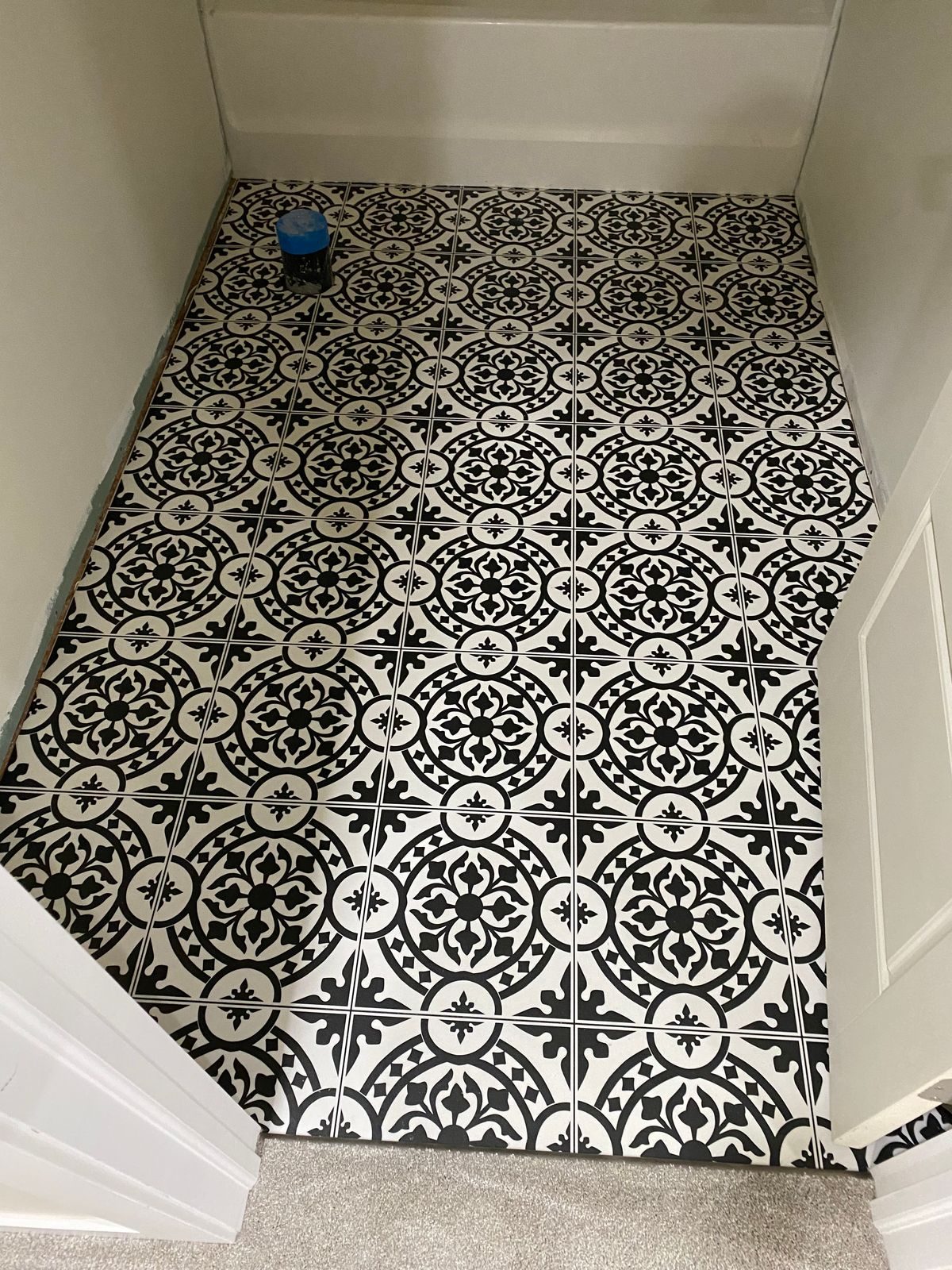 Patterned black-and-white tile floor