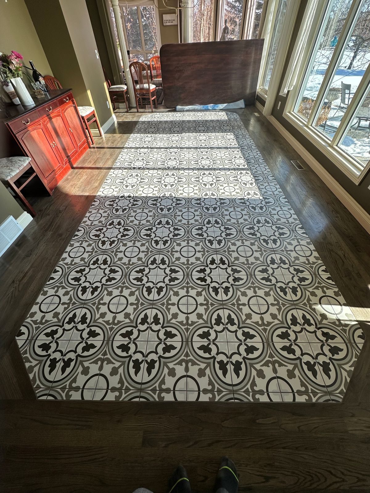 Patterned tile runner in a long hallway